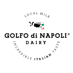 Circular logo for Golfo di Napoli Dairy. A cow with an Italian flag spot is in the center, surrounded by the text LOCAL MILK above and INCREDIBLE ITALIAN TASTE below—perfect for their exclusive auction of like new Comat cheese equipment.